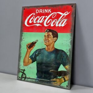 Coca-Cola Joven en Bicicleta